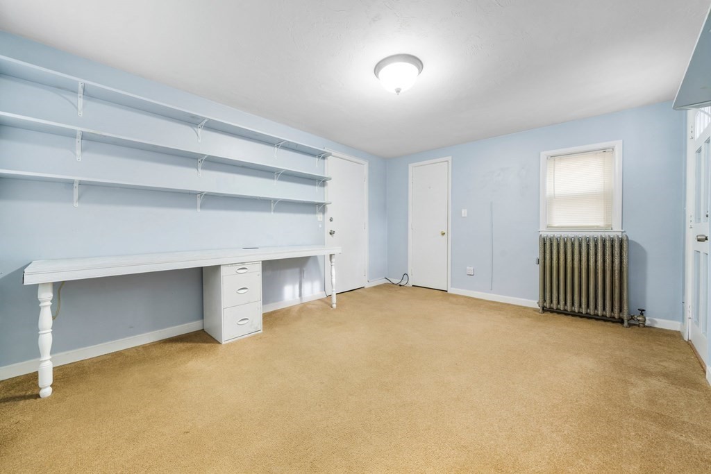 44 Beaconsfield Road Worcester, MA 01602 - Photo 12 of 32 an empty room with a empty space and windows