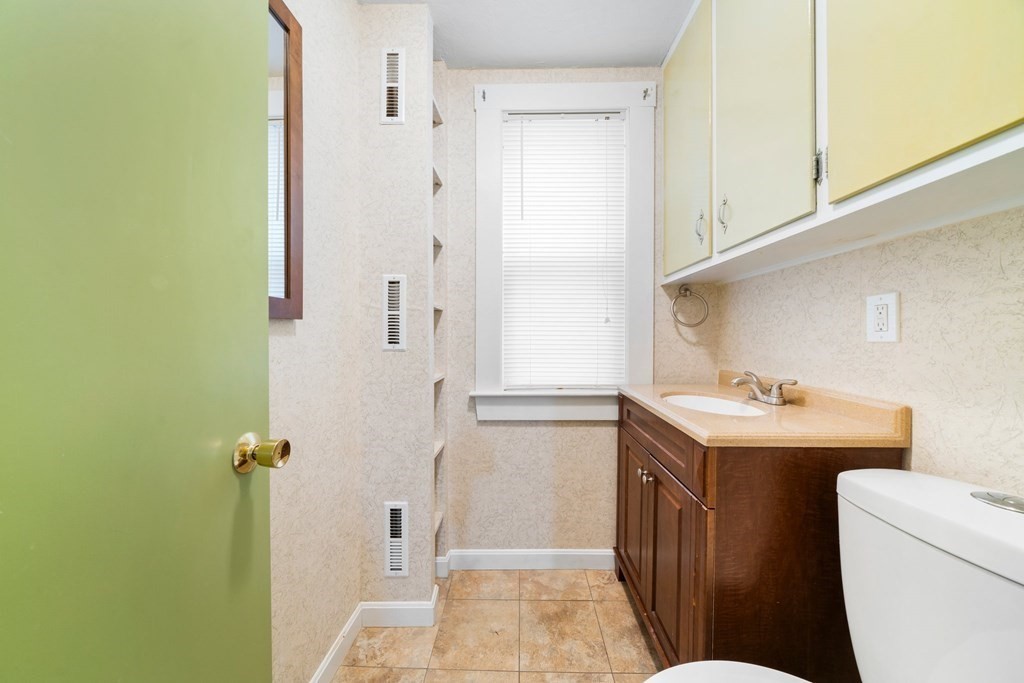 44 Beaconsfield Road Worcester, MA 01602 - Photo 14 of 32 a bathroom with a sink a toilet and shower