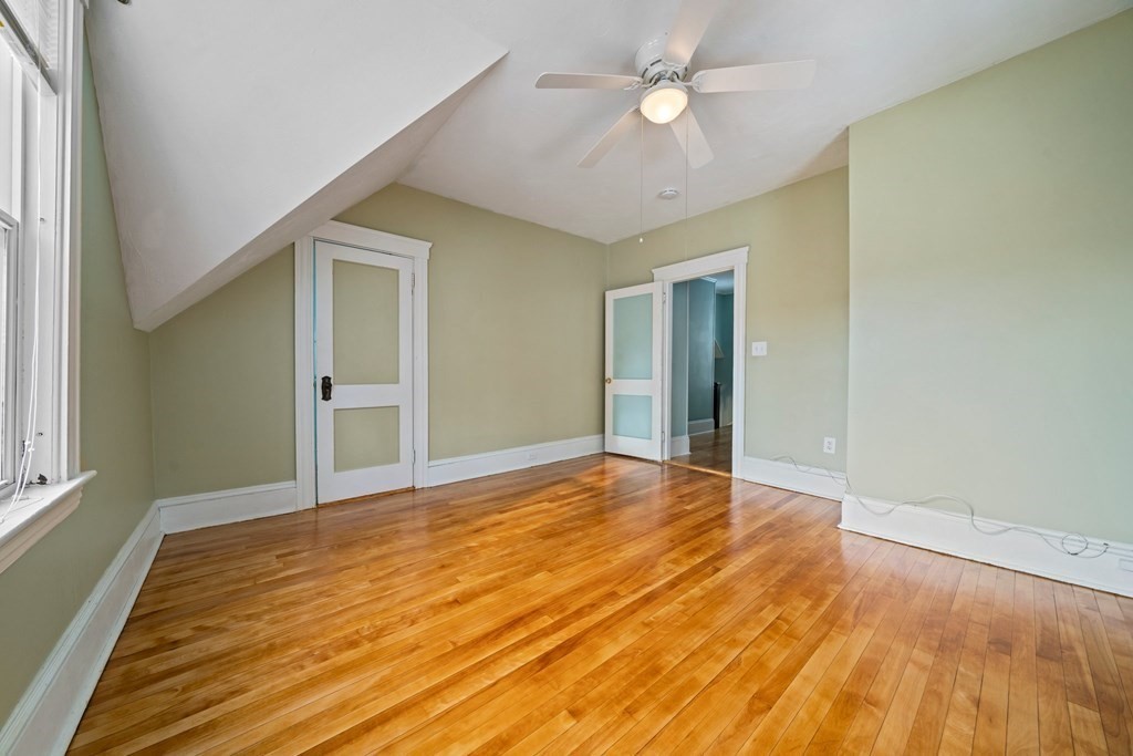 44 Beaconsfield Road Worcester, MA 01602 - Photo 16 of 32 a view of an empty room with wooden floor and a window