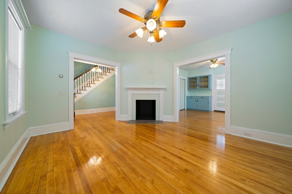44 Beaconsfield Road Worcester, MA 01602 - Photo 3 of 32 a view of empty room with wooden floor and fan