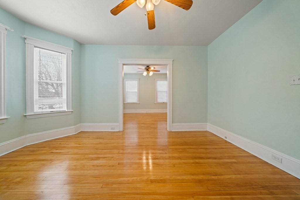 44 Beaconsfield Road Worcester, MA 01602 - Photo 6 of 32 wooden floor in an empty room with a window