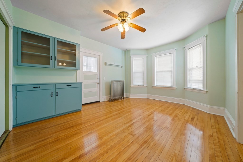 44 Beaconsfield Road Worcester, MA 01602 - Photo 7 of 32 a view of an empty room with window and a kitchen