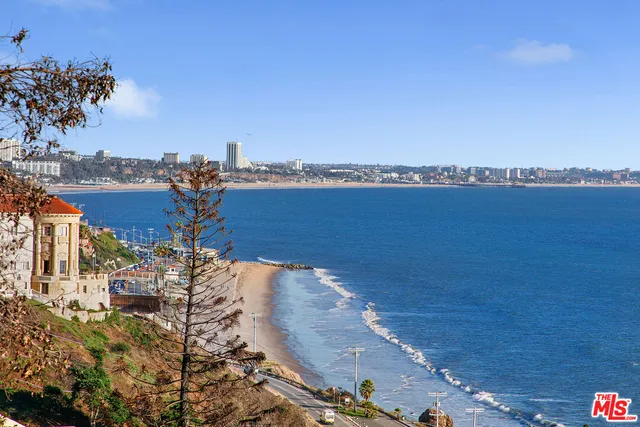 a view of a ocean with a building in the background