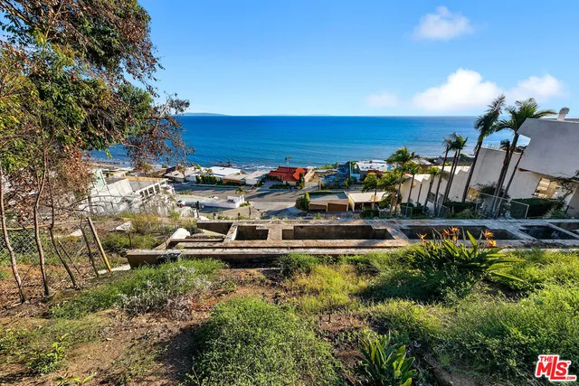a view of a water with a building in the background