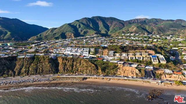 a view of multiple houses with outdoor space