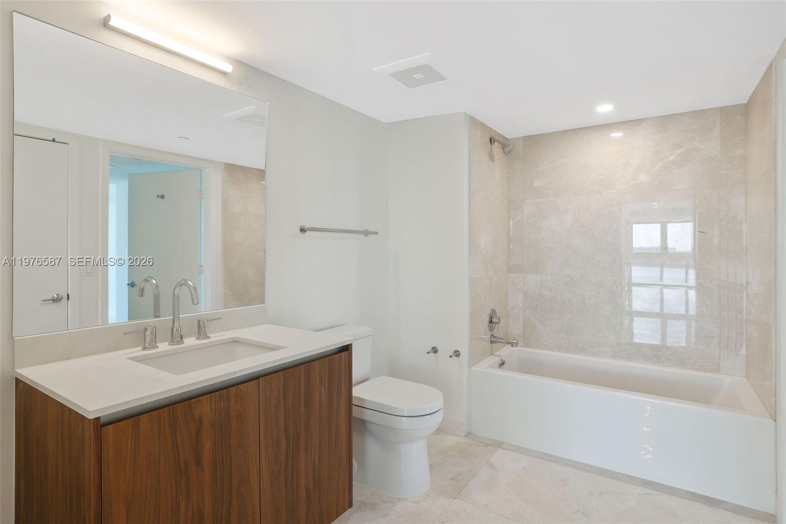 1500 Bay Road, Unit N0516 Miami Beach, FL 33139 - Photo 22 of 88 a bathroom with a sink a toilet and shower