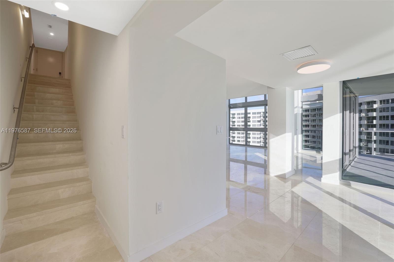 1500 Bay Road, Unit N0516 Miami Beach, FL 33139 - Photo 23 of 88 a view of an entryway with wooden floor and door