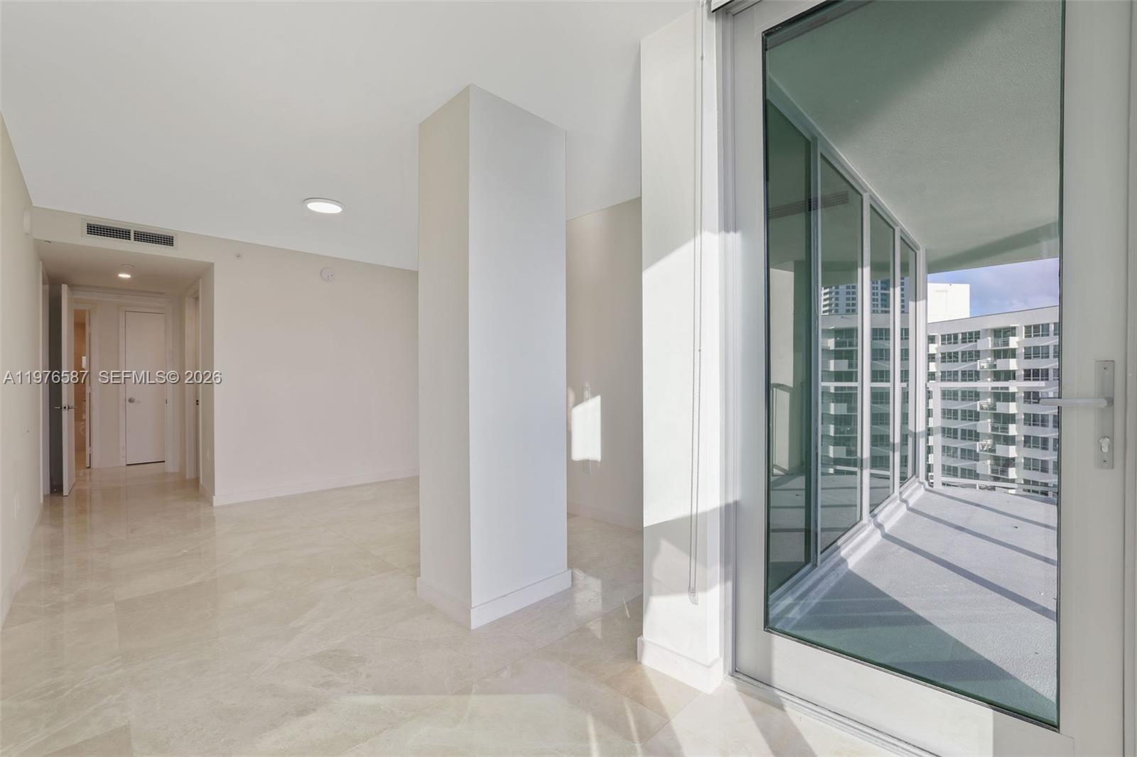 1500 Bay Road, Unit N0516 Miami Beach, FL 33139 - Photo 26 of 88 a view of a hallway with wooden floor and entryway