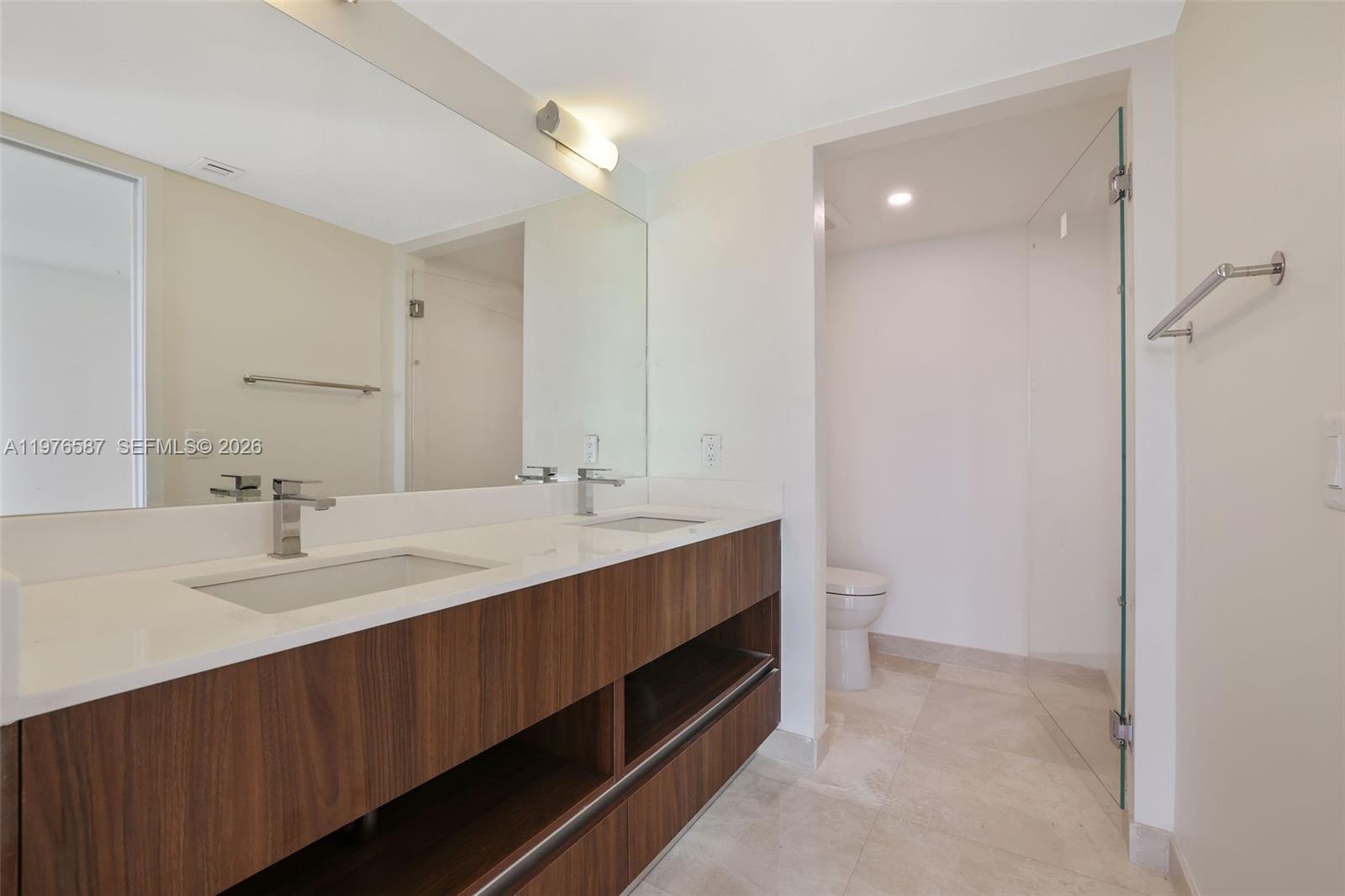 1500 Bay Road, Unit N0516 Miami Beach, FL 33139 - Photo 34 of 88 a spacious bathroom with a double vanity sink mirror and double