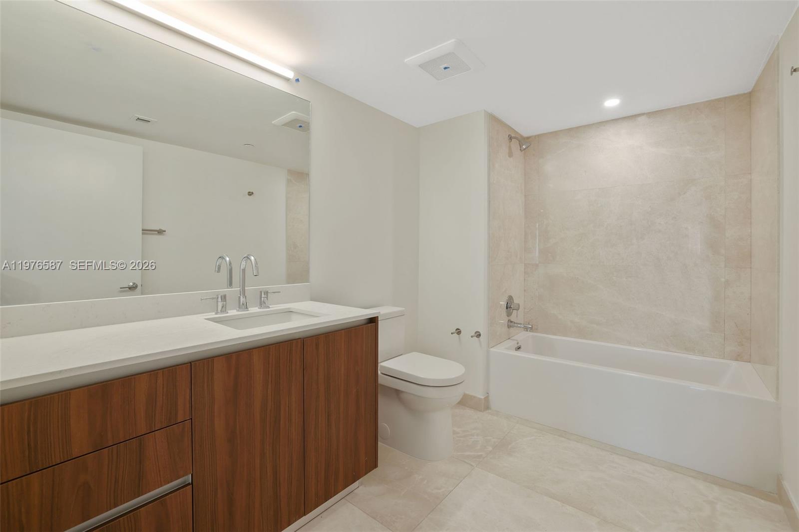 1500 Bay Road, Unit N0516 Miami Beach, FL 33139 - Photo 41 of 88 a bathroom with a sink a toilet and shower