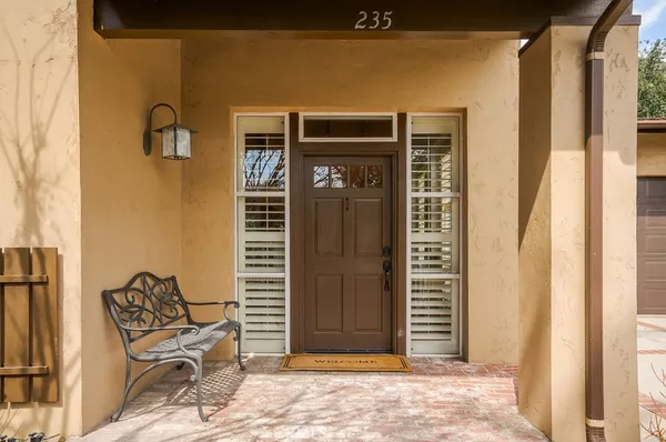 a front view of a house with outdoor seating