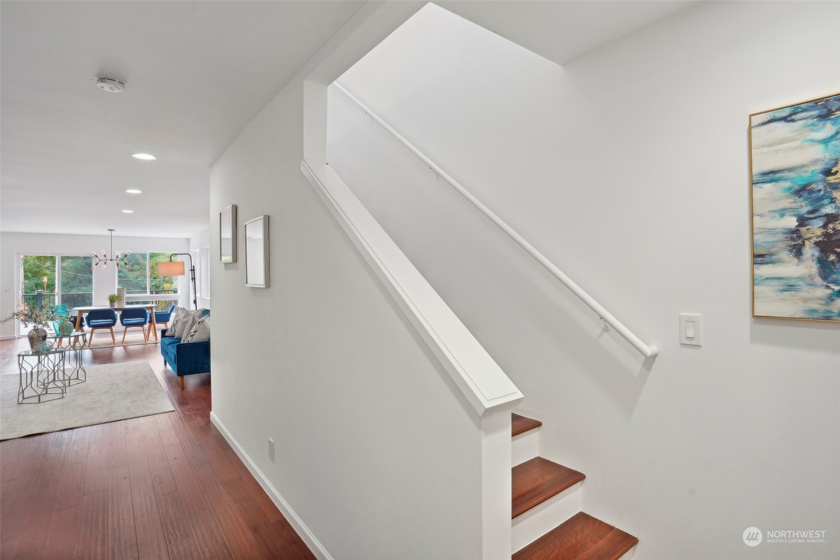 7453 Gatewood Road Southwest Seattle, WA 98136 - Photo 14 of 40 a view of entryway and livingroom with wooden floor