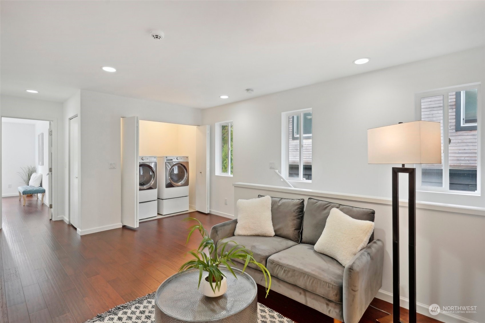 7453 Gatewood Road Southwest Seattle, WA 98136 - Photo 17 of 40 a living room with furniture and a wooden floor