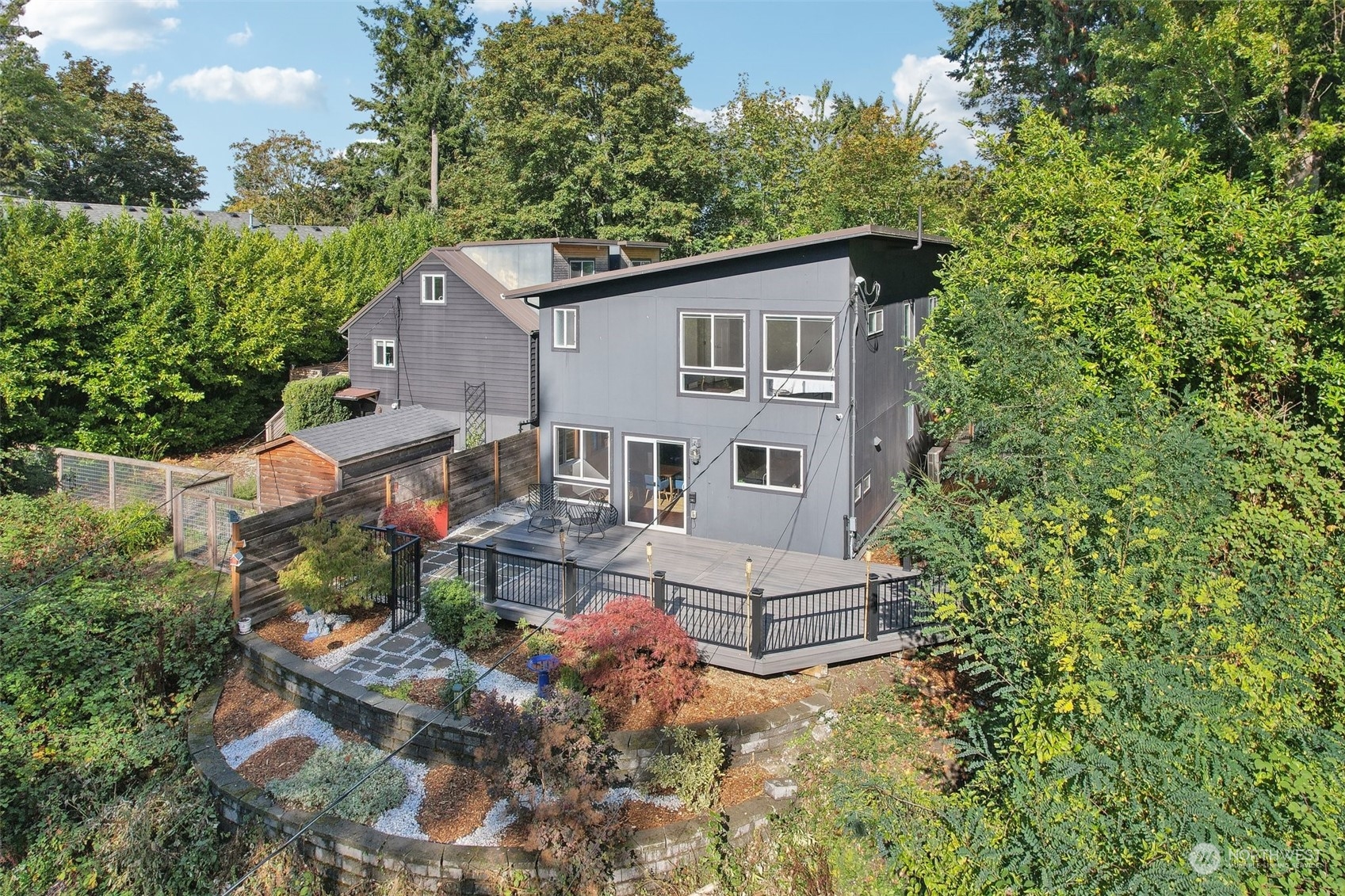 7453 Gatewood Road Southwest Seattle, WA 98136 - Photo 2 of 40 a view of a house with a yard and sitting area