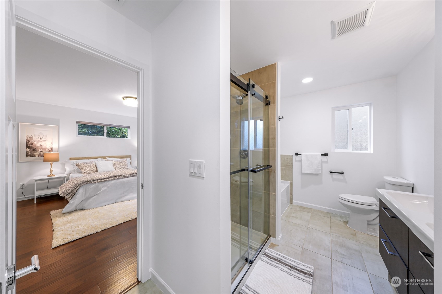 7453 Gatewood Road Southwest Seattle, WA 98136 - Photo 21 of 40 a bathroom with a tub shower and toilet