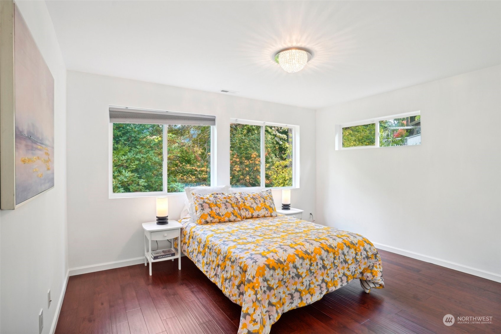 7453 Gatewood Road Southwest Seattle, WA 98136 - Photo 25 of 40 a bedroom with a bed a window and wooden floor