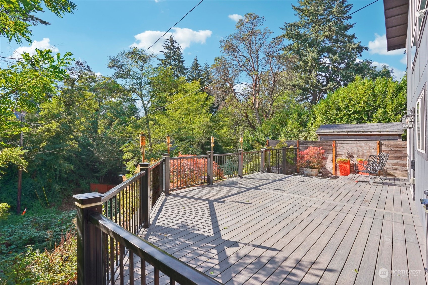 7453 Gatewood Road Southwest Seattle, WA 98136 - Photo 33 of 40 a view of a roof deck with wooden floor and fence