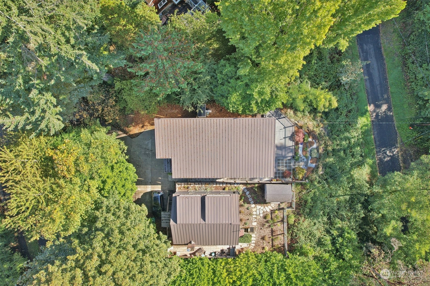 7453 Gatewood Road Southwest Seattle, WA 98136 - Photo 35 of 40 an aerial view of a house with a yard and trees all around