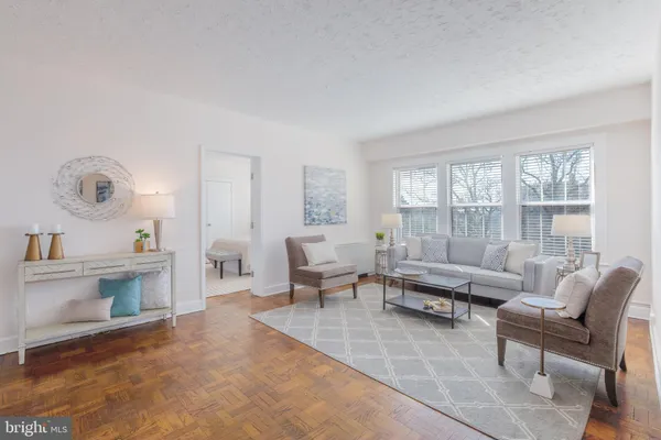 a living room with furniture and a table