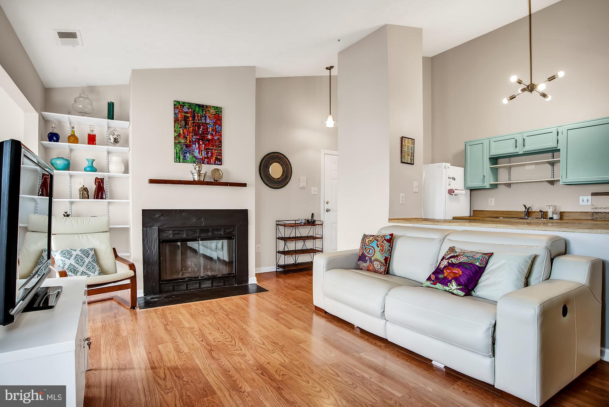 647 Deering Road, Unit 2M Pasadena, MD 21122 - Photo 2 of 25 Large living room with fireplace