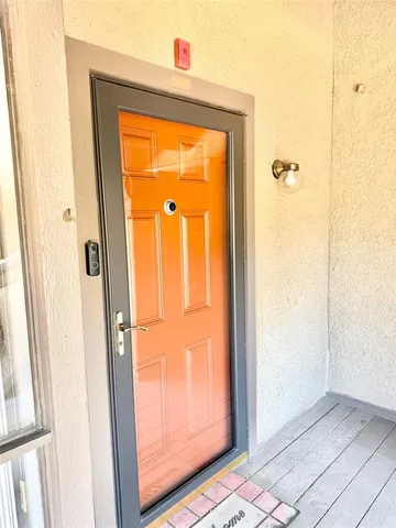 a view of a bathroom with a glass door