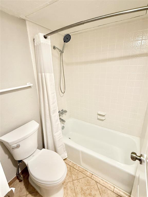 4545 North O'Connor Road, Unit 2251 Irving, TX 75062 - Photo 17 of 25 a white toilet sitting next to a bath tub and shower