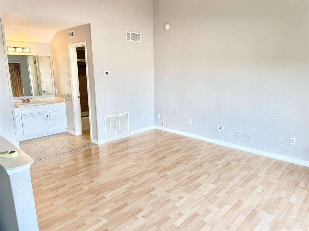 4545 North O'Connor Road, Unit 2251 Irving, TX 75062 - Photo 20 of 25 wooden floor in an empty room