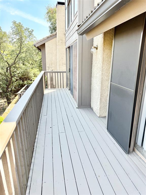 4545 North O'Connor Road, Unit 2251 Irving, TX 75062 - Photo 24 of 25 a view of a balcony with wooden floor and fence