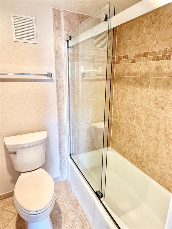 4545 North O'Connor Road, Unit 2251 Irving, TX 75062 - Photo 9 of 25 a bathroom with a toilet and a shower