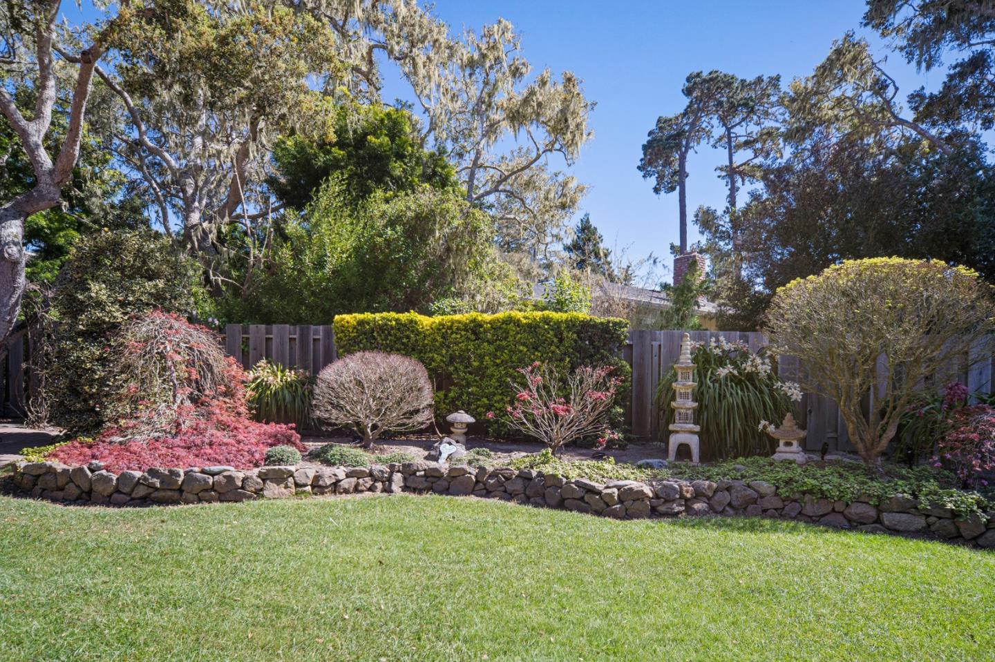 2911 Colton Road Pebble Beach, CA 93953 - Photo 42 of 46 a backyard of a house with table and chairs