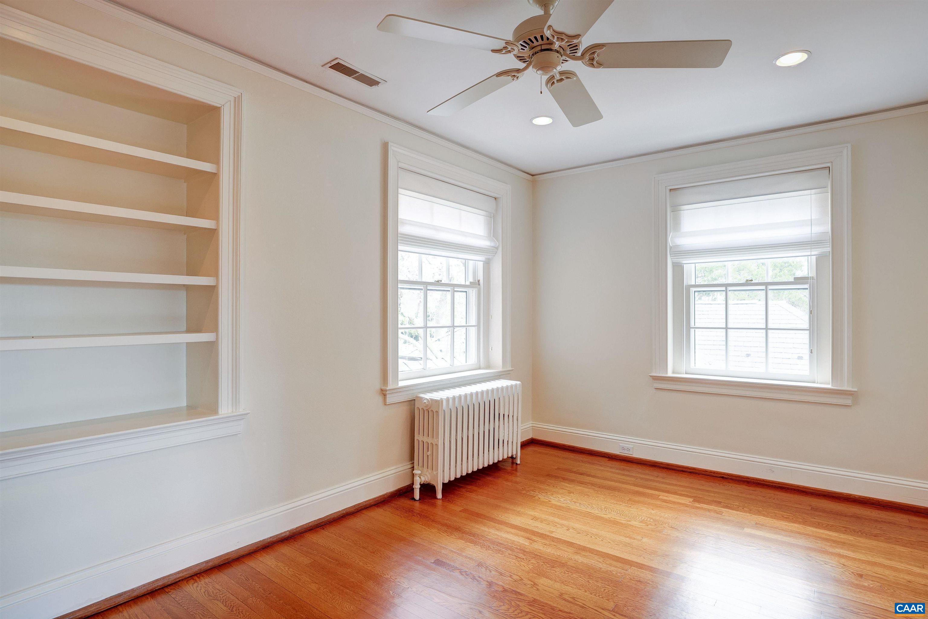 3466 Morgantown Road Charlottesville, VA 22903 - Photo 12 of 35 a view of an empty room with a window and wooden floor