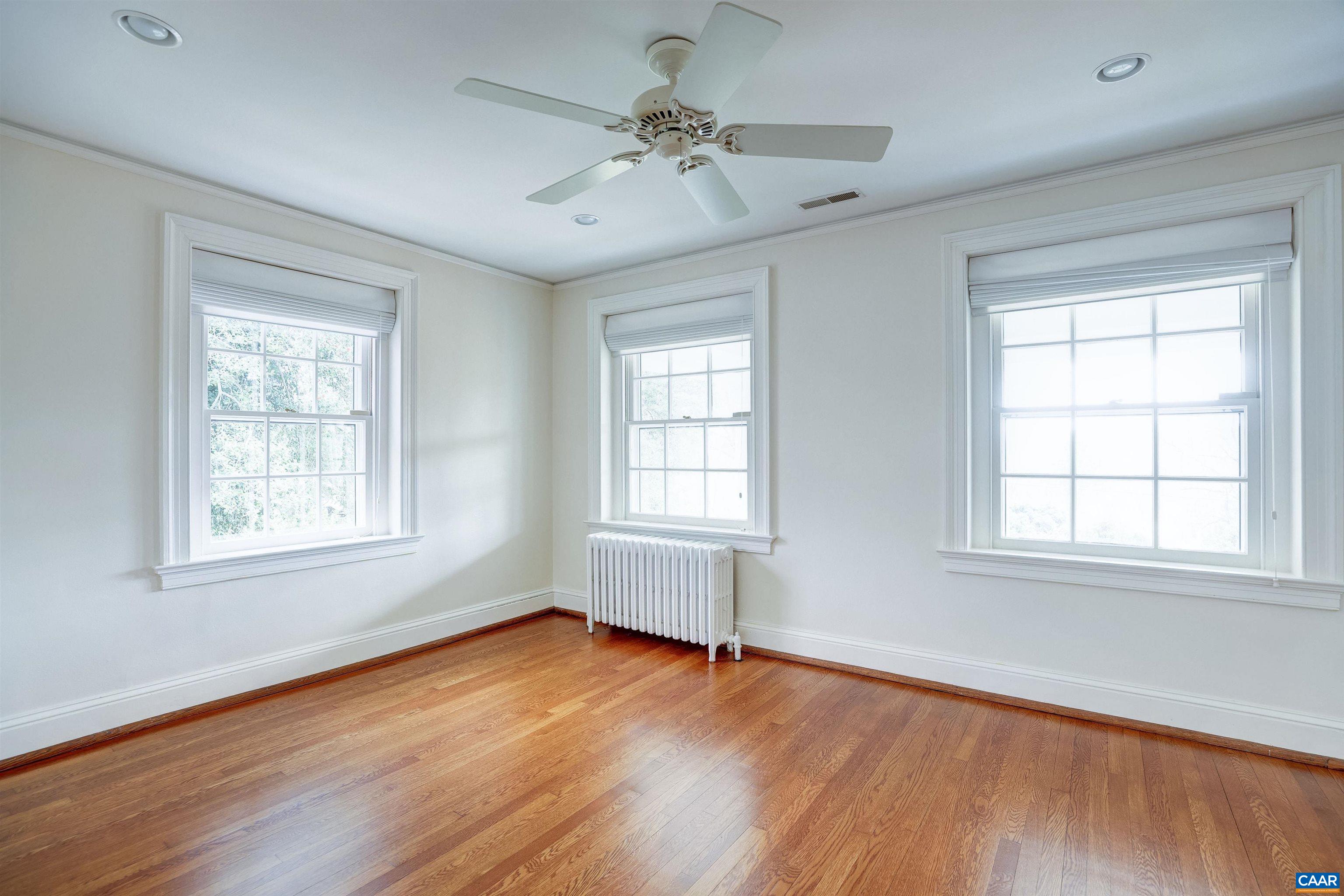 3466 Morgantown Road Charlottesville, VA 22903 - Photo 14 of 35 a view of an empty room with wooden floor and a window