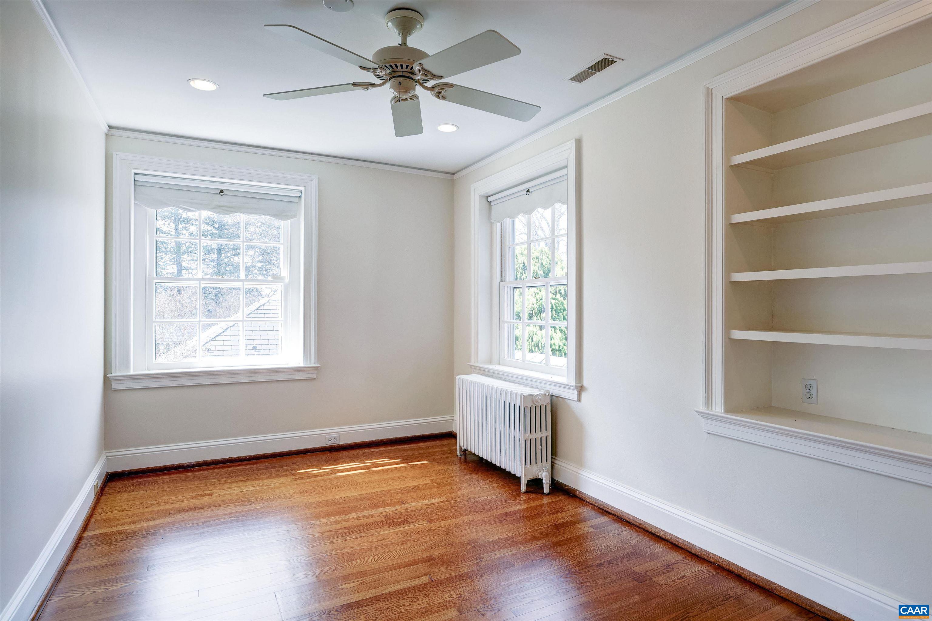 3466 Morgantown Road Charlottesville, VA 22903 - Photo 18 of 35 a view of an empty room with a window and wooden floor