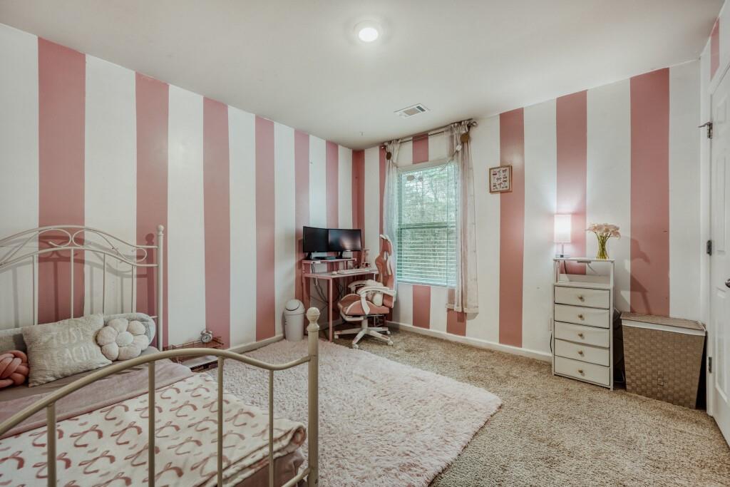 1526 Woodvale Street Hampton, GA 30228 - Photo 22 of 31 a room with furniture and a window