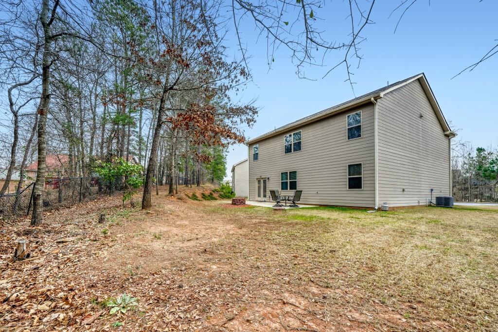 1526 Woodvale Street Hampton, GA 30228 - Photo 29 of 31 a view of a house with a yard