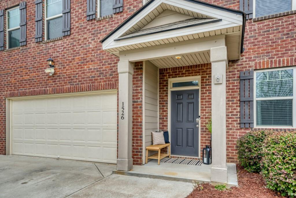 1526 Woodvale Street Hampton, GA 30228 - Photo 4 of 31 a front view of a house with a garage