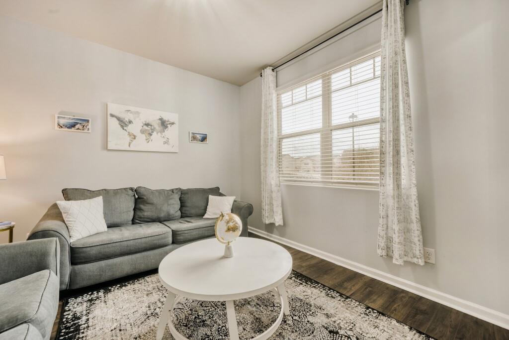 1526 Woodvale Street Hampton, GA 30228 - Photo 6 of 31 a living room with furniture and a window
