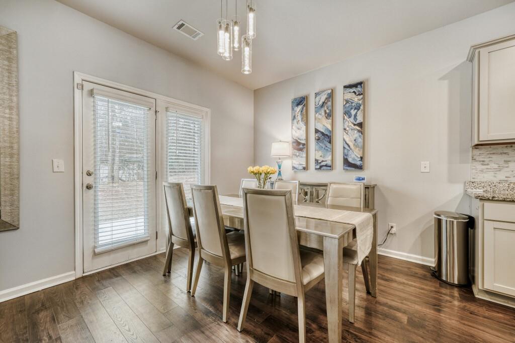 1526 Woodvale Street Hampton, GA 30228 - Photo 10 of 31 a view of a dining room with furniture window and wooden floor