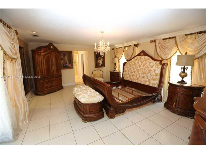 3845 Southwest 128th Avenue Miami, FL 33175 - Photo 15 of 35 a living room with furniture a rug and a window