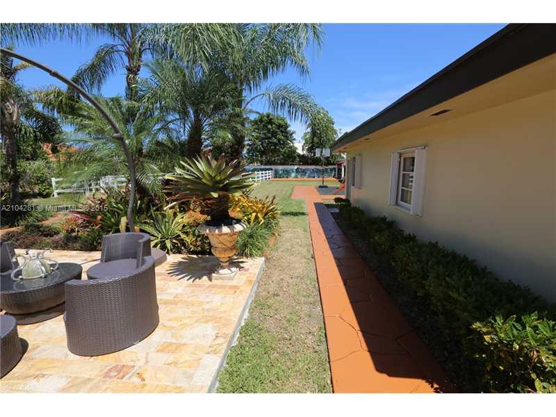 3845 Southwest 128th Avenue Miami, FL 33175 - Photo 28 of 35 a swimming pool with potted plants