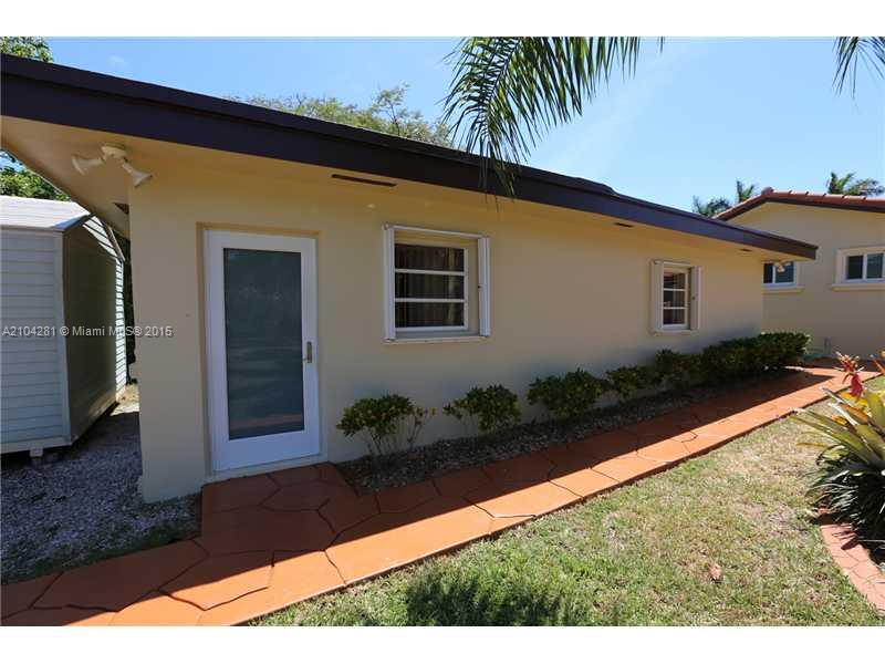 3845 Southwest 128th Avenue Miami, FL 33175 - Photo 29 of 35 a backyard of a house with potted plants