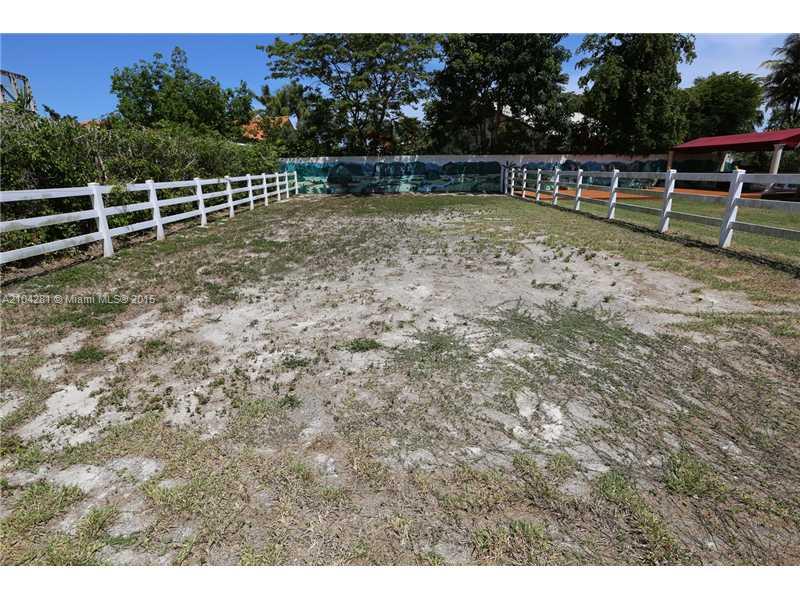 3845 Southwest 128th Avenue Miami, FL 33175 - Photo 35 of 35 a view of a yard with wooden fence