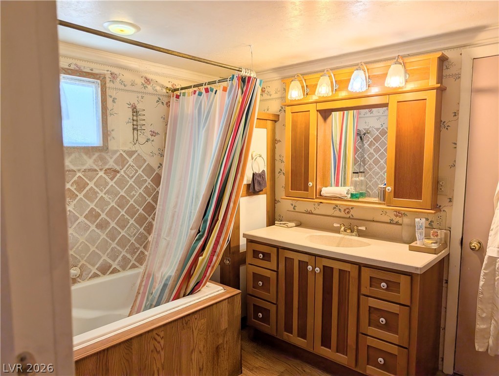 997 Phillips Street Panaca, NV 89042 - Photo 13 of 19 A well-lit bathroom offers a tiled shower and a spacious vanity with ample storage.