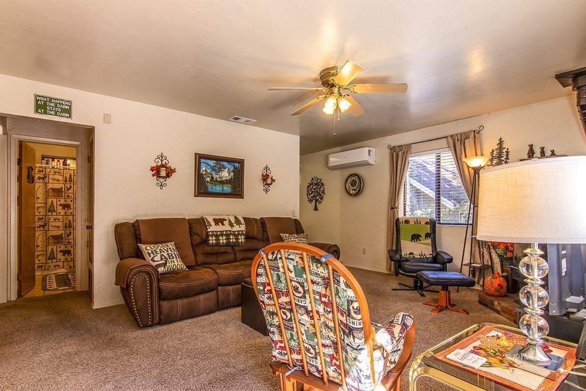 26833 Idyllwild Road Idyllwild, CA 92549 - Photo 13 of 38 a living room with furniture and a large window