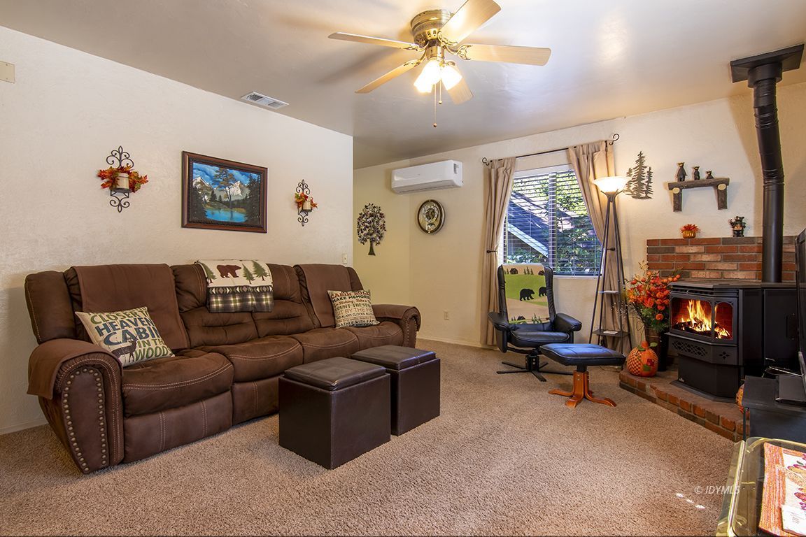 26833 Idyllwild Road Idyllwild, CA 92549 - Photo 14 of 38 a living room with furniture and a flat screen tv