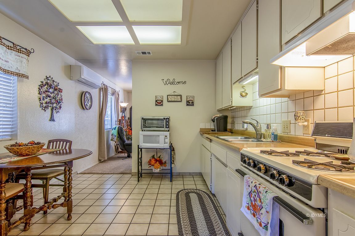 26833 Idyllwild Road Idyllwild, CA 92549 - Photo 21 of 38 a kitchen with stainless steel appliances granite countertop a stove and a sink