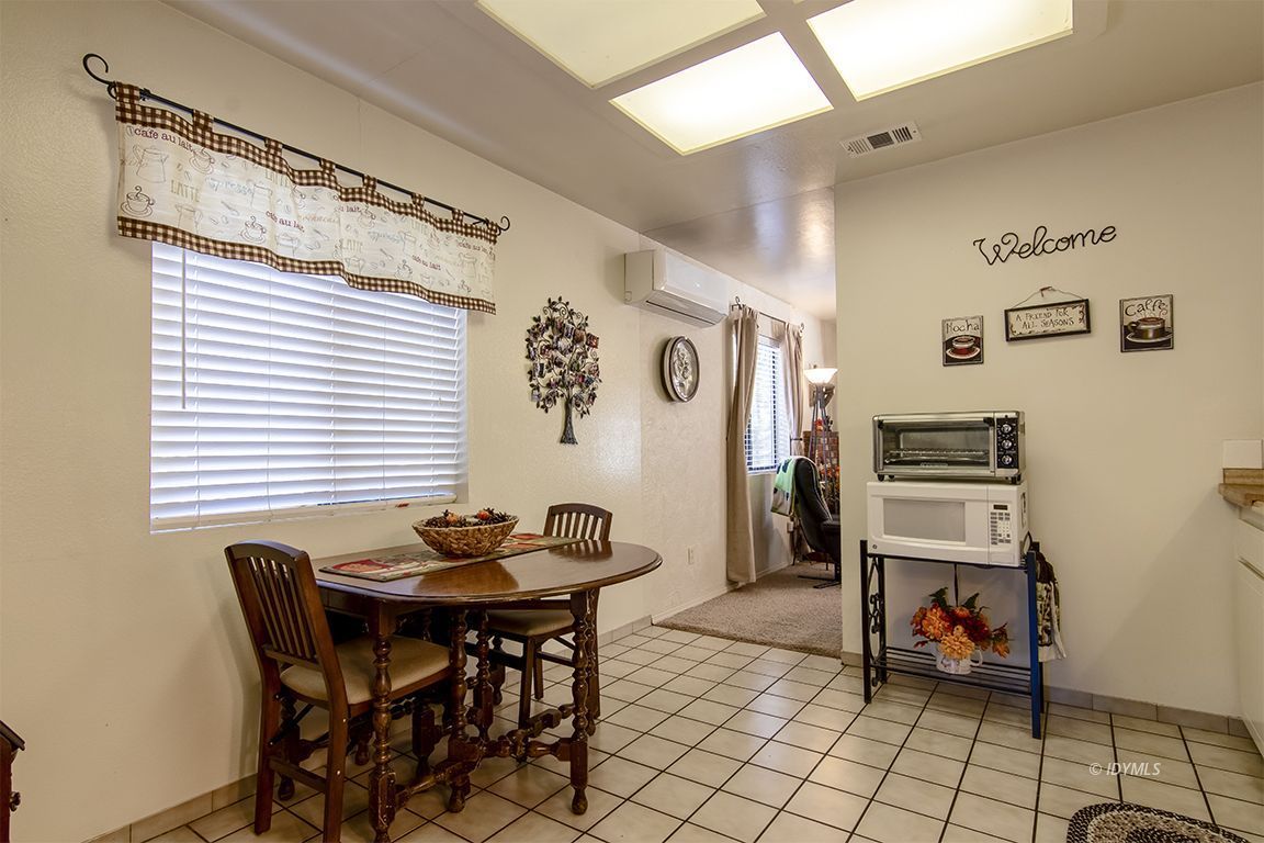 26833 Idyllwild Road Idyllwild, CA 92549 - Photo 22 of 38 a dining room with furniture and window