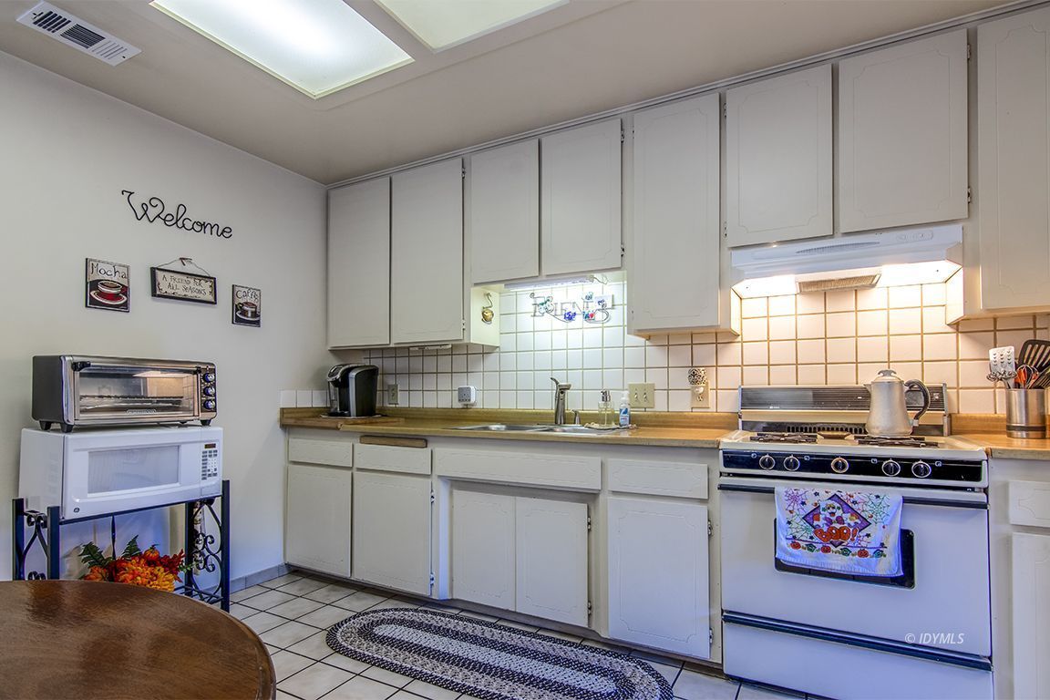 26833 Idyllwild Road Idyllwild, CA 92549 - Photo 23 of 38 a kitchen with stainless steel appliances granite countertop a stove and cabinets