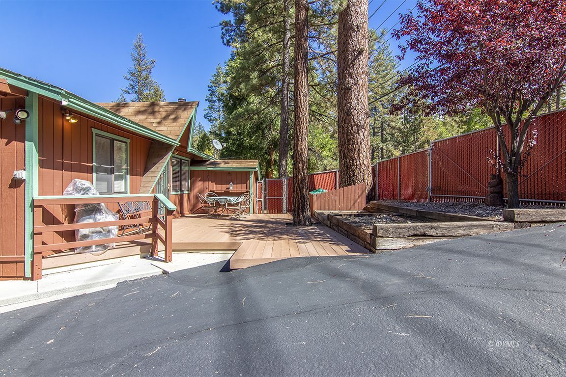 26833 Idyllwild Road Idyllwild, CA 92549 - Photo 5 of 38 a view of a house with wooden fence next to a road
