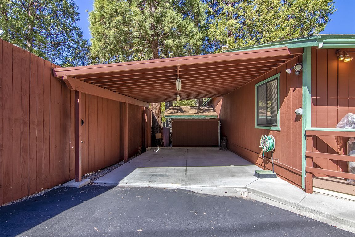 26833 Idyllwild Road Idyllwild, CA 92549 - Photo 6 of 38 a view of backyard with wooden fence and a barbeque